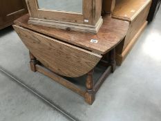 A small solid oak drop leaf table