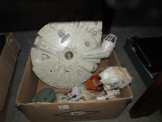 A Star Wars Millenium Falcon and other items.