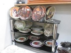 A quantity of collectors plates including Norman Rockwell, Royal Doulton etc.