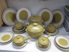 A Denby stoneware dinner set with tureens and soup ramekins