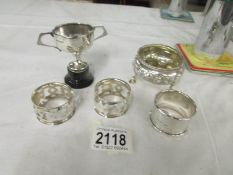3 silver napkin rings and a silver salt approximately 110 grams together with a silver cup on