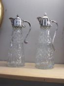 2 fine crystal carafes with silver plate lids spouts and handles