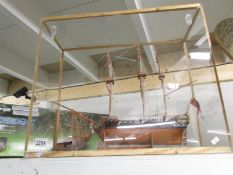 A cased model of an English frigate.