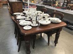 A Victorian mahogany extending dining table and 4 mahogany balloon back chairs