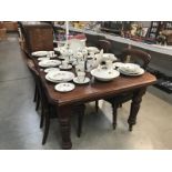 A Victorian mahogany extending dining table and 4 mahogany balloon back chairs