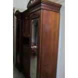 A Victorian mahogany combination wardrobe.