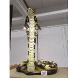 A ceramic cobra (damage to neck).