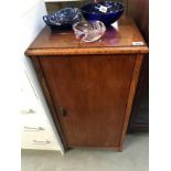 A 1950's oak cupboard