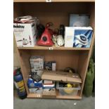 2 shelves of electrical items including steamers & iron etc.