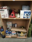 2 shelves of electrical items including steamers & iron etc.