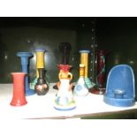 A quantity of vases and candle holders including Bretby