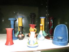 A quantity of vases and candle holders including Bretby