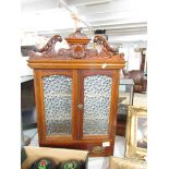 A small mahogany cabinet.