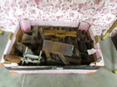 A box of old woodworking planes.