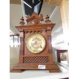 An American oak 8 day mantel clock with brass dial, in working order.