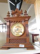 An American oak 8 day mantel clock with brass dial, in working order.