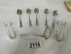 5 silver teaspoons, 2 silver sugar tongs and a silver sifter spoon, approximately 93 grams.