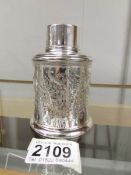 A silver lidded pot with engraving, hall marked for Birmingham 1911/12, approximately 96 grams.