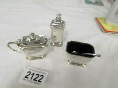 A 3 piece silver condiment set with original blue glass liners (mustard pot liner a/f),