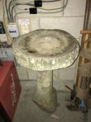 A stone bird bath