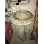 A stone bird bath