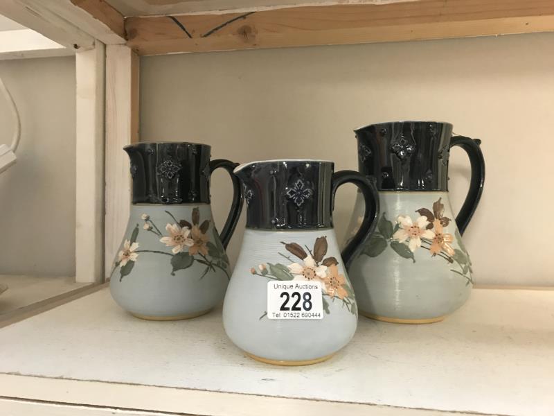 A set of 3 graduated jugs