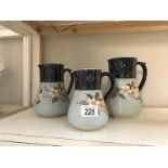 A set of 3 graduated jugs