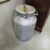 A vintage metal milk churn (no maker of owner markings).