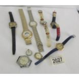 A mixed lot of wrist watches including a ladies gold example.