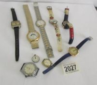 A mixed lot of wrist watches including a ladies gold example.