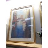 A gilt framed print of a Venetian scene