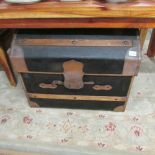A good quality dome top travel trunk with interior.