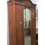 An Edwardian inlaid single mirror door wardrobe.