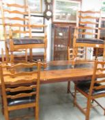 A set of 6 oak ladder back chairs comprising 2 carvers and 4 dining.