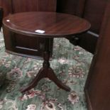 A 20th century mahogany tripod table.