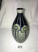 A Moorcroft peacock parade first quality vase