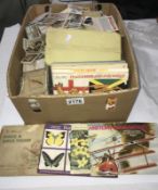A large quantity of cigarette cards, silks & books including Player, Wills, Gallagher,