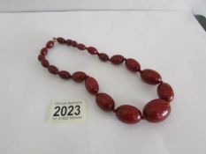 A fine red amber necklace.