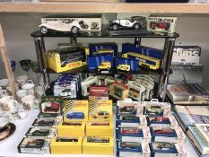 A large quantity of boxed die cast including Days Gone & Maisto etc.