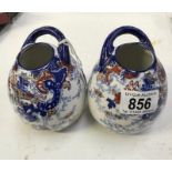 A pair of late 19th early 20th century Imari pattern vases