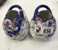 A pair of late 19th early 20th century Imari pattern vases