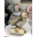 A quantity of stoneware hot water bottles etc.