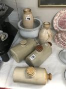 A quantity of stoneware hot water bottles etc.