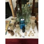 A quantity of old bottles including cod & stoneware jars