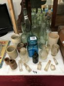 A quantity of old bottles including cod & stoneware jars