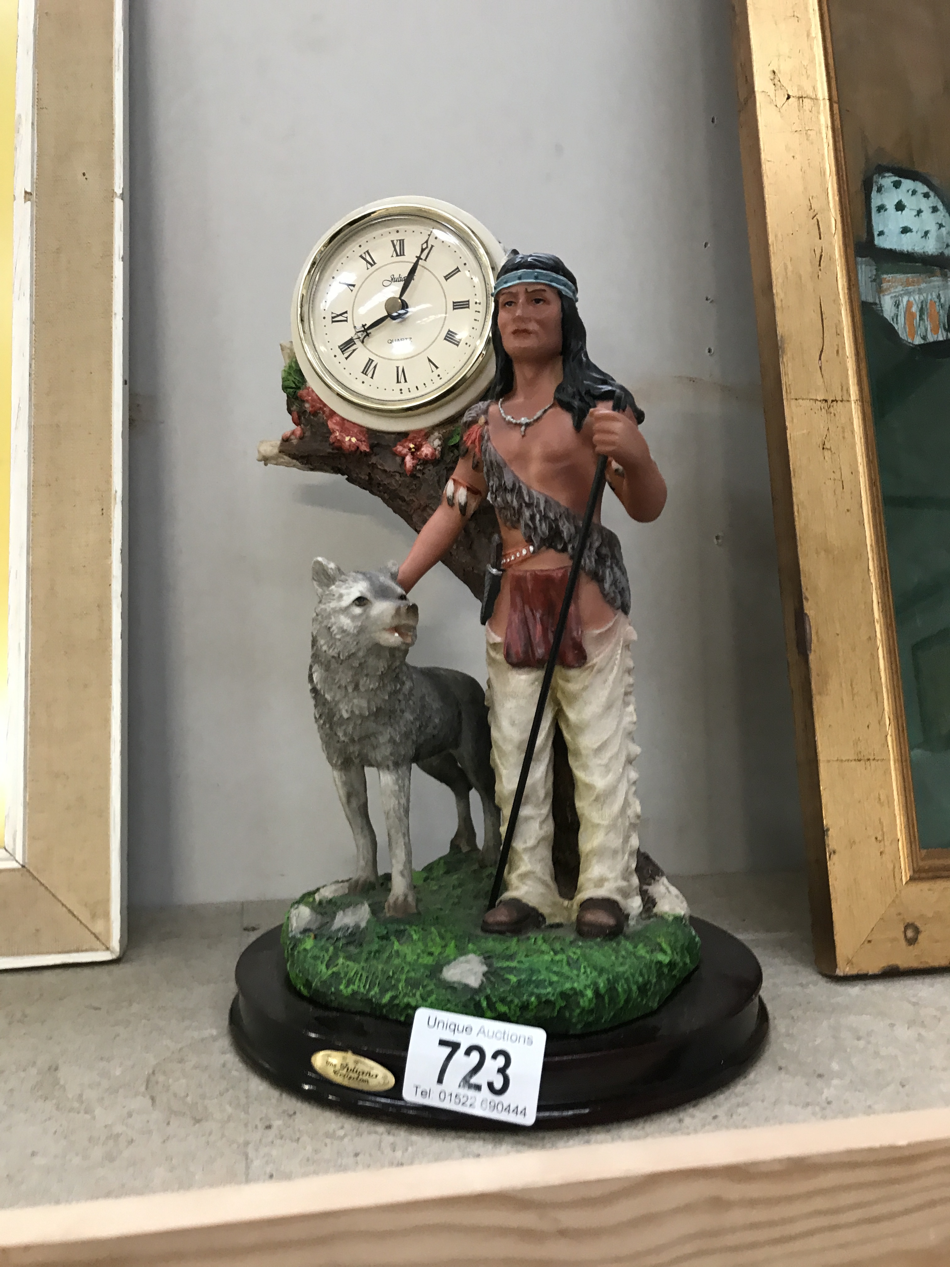 A Juliana clock with Indian figure & wolf