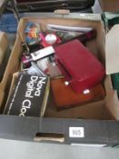 An interesting box of miscellaneous items including technical instruments, lighter, scales, rules,