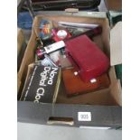 An interesting box of miscellaneous items including technical instruments, lighter, scales, rules,