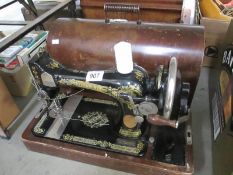 A cased Singer sewing machine