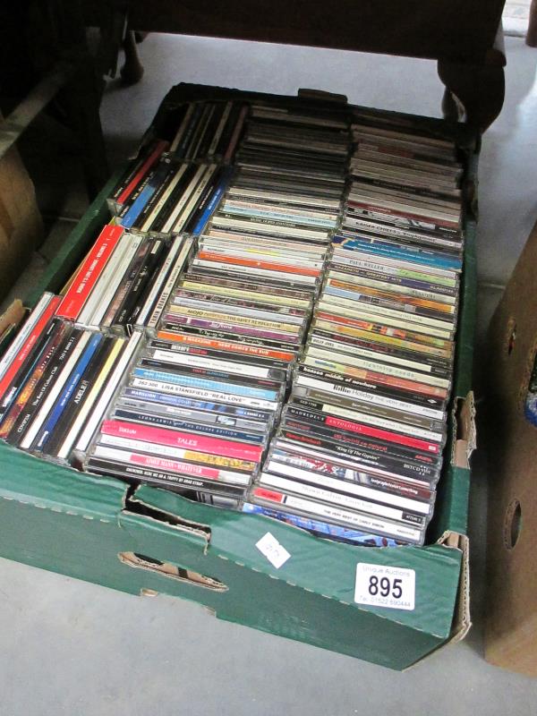 A box of assorted CDs